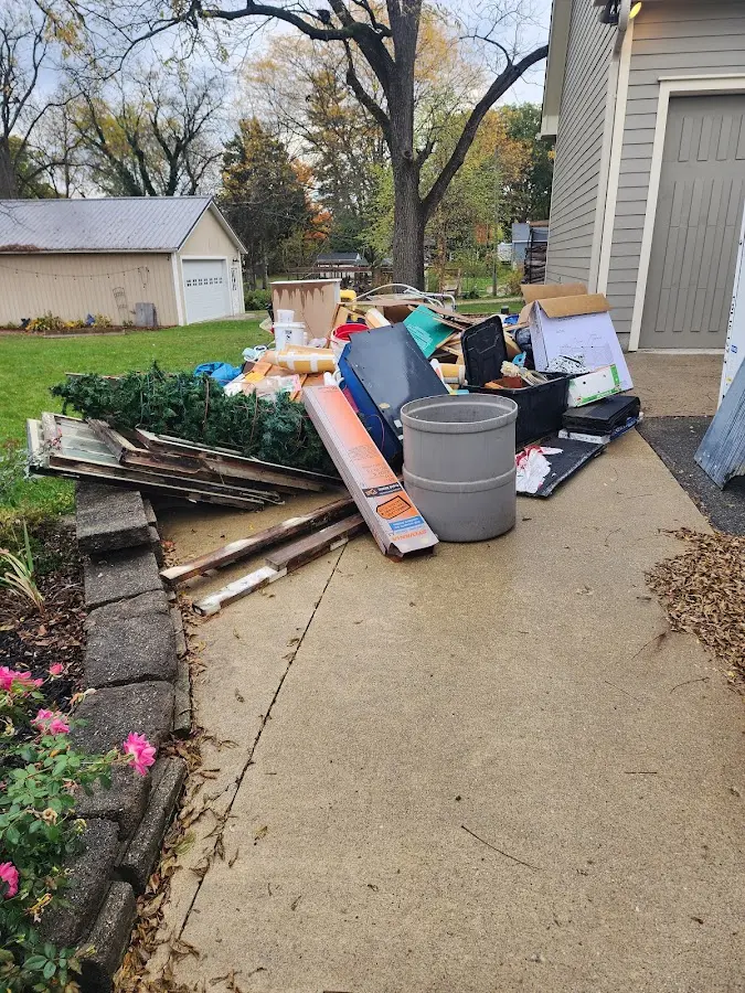 Dumpster being loaded with debris for 30 Yard Dumpster Rental in Denair
